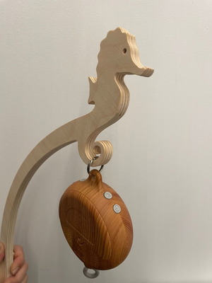 Wooden crib rail holder for mobile used with rotating and music mechanism