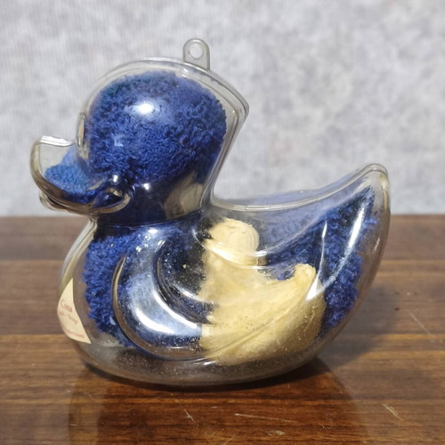 Decorative plastic duck like new with towel and small soap