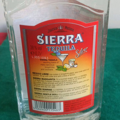 Sierra vintage tequila used, opened bottle with cap damage