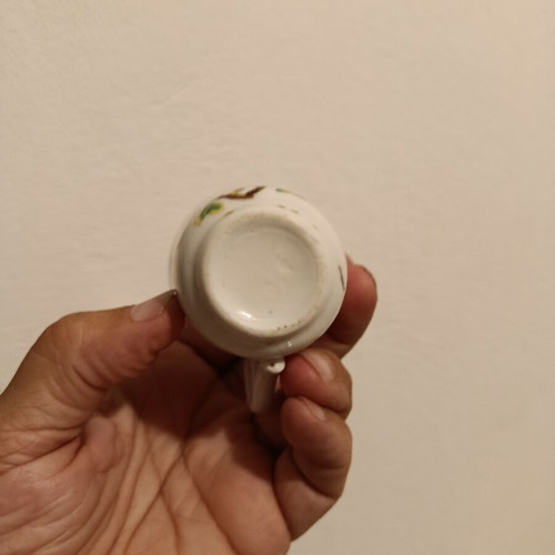 Vintage porcelain cup with bird design