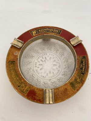 Vintage ashtray used, solid aluminum gold color with glass