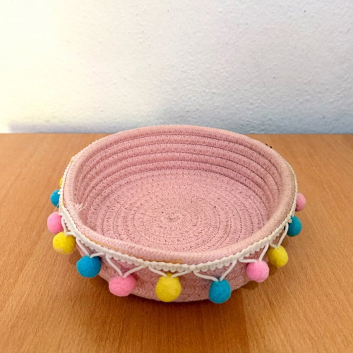 Handmade pink basket with colorful pom poms like new