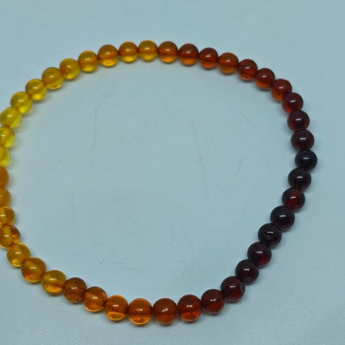 Handmade bracelet from natural amber with color gradient like new