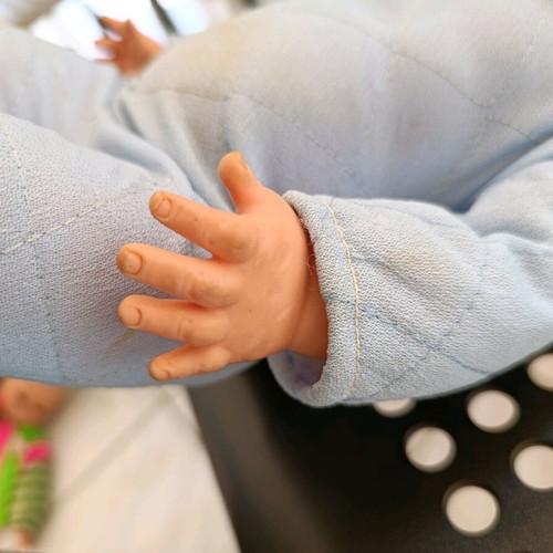 Vintage baby doll used with missing parts and wear