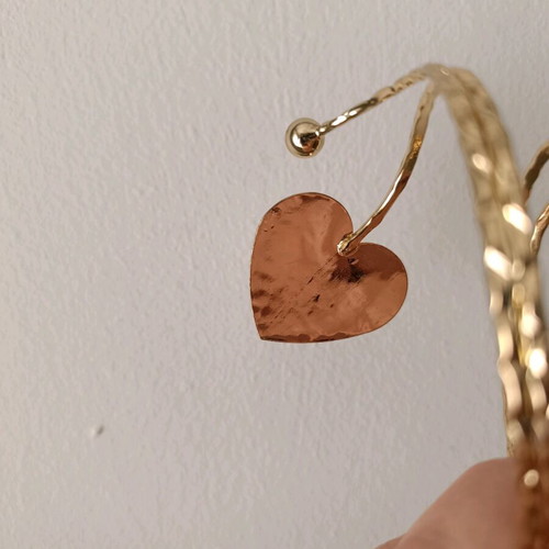 Cuff bracelet used with 2 gold-tone hearts