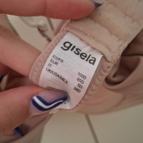 Beige bra new with small front tear