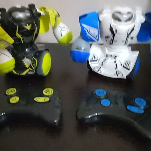 Set of two fighting robots with controllers and sounds used