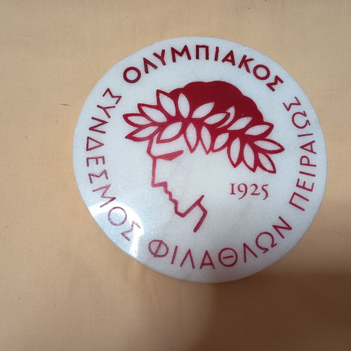 Olympiakos emblem on white marble, like new