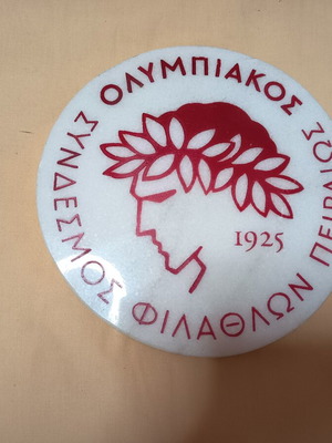 Olympiakos emblem on white marble, like new