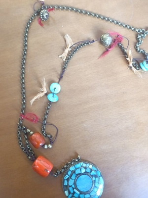 Long necklace with turquoise craft element used, defect