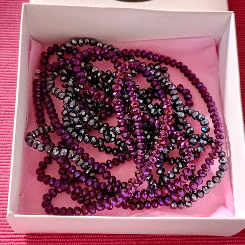 Package. Two long necklaces, in two shades.