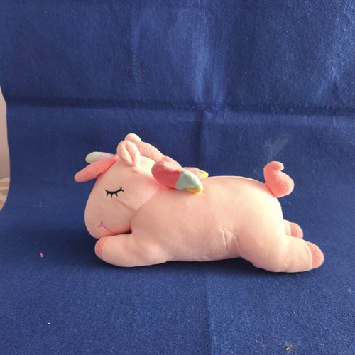 Pink plush unicorn with colorful wings