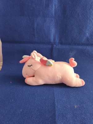 Pink plush unicorn with colorful wings