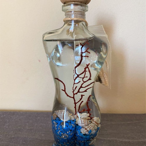 Female figure candle new with shells and stones