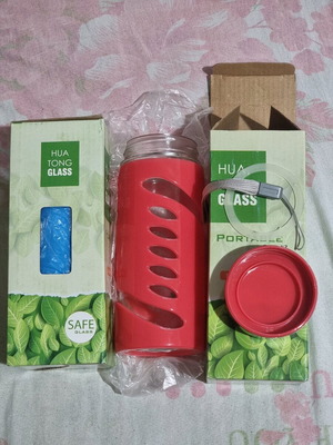 HUA TONG glass water bottle new with silicone protective sleeve