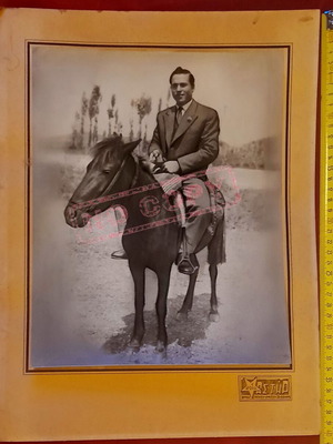 Vintage photo of man on horseback in suit, Astir studio