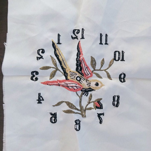 Vintage machine embroidery clock with bird on beige fabric new