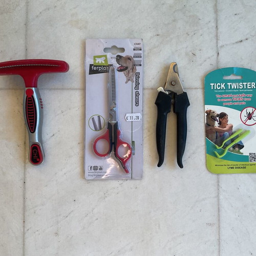 Dog grooming set used with double brush, thinning comb, nail clipper, tick remover