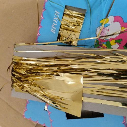 Vintage Christmas tinsel in red, gold and silver