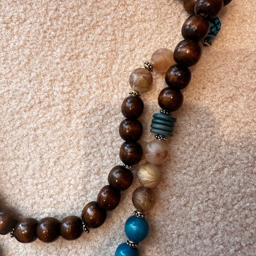 Long handmade necklace with wooden beads in brown and turquoise, like new