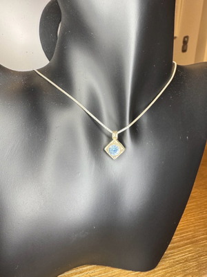 Silver necklace with rhombus pendant and blue decorative door like new