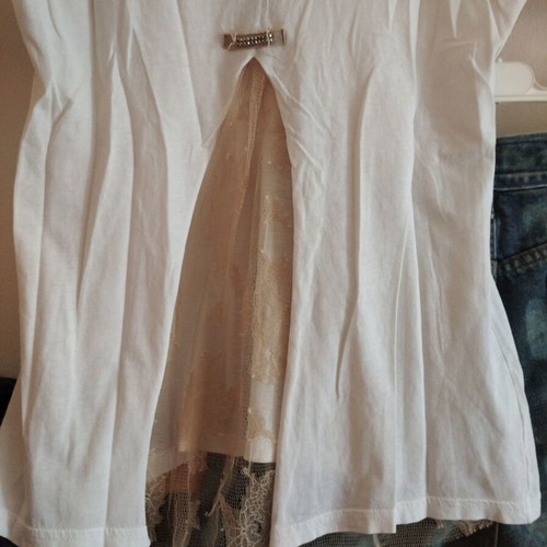 White blouse with lace back and decorative chain, size M