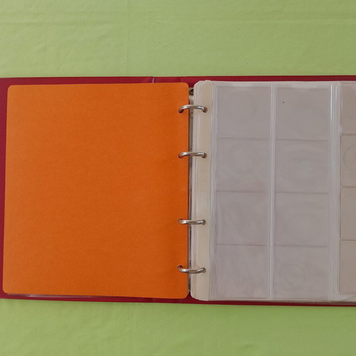 Coin album used with 5 slides for 133 coins
