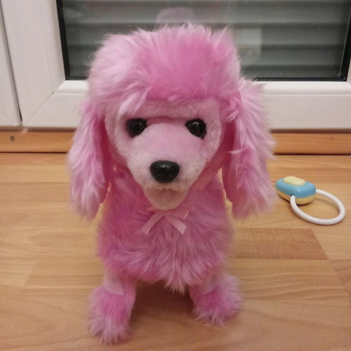Toy dog with remote control like new that barks and moves