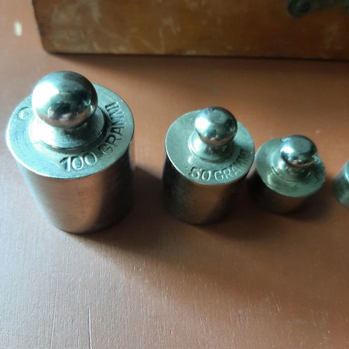 Wooden collectible box with cast iron weights