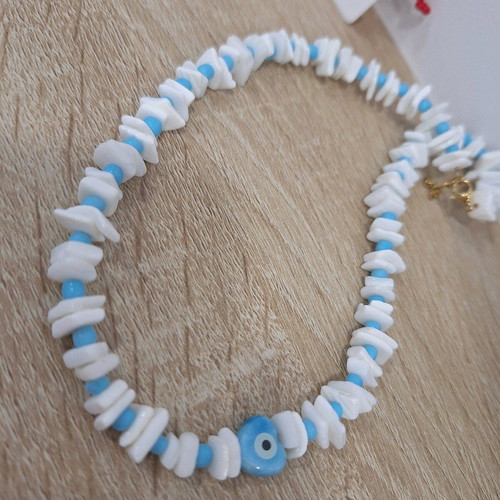 Handmade necklace with coral, glass beads and ceramic heart eye
