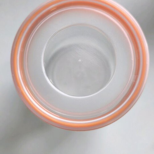 Storage container round like new, transparent with orange lid
