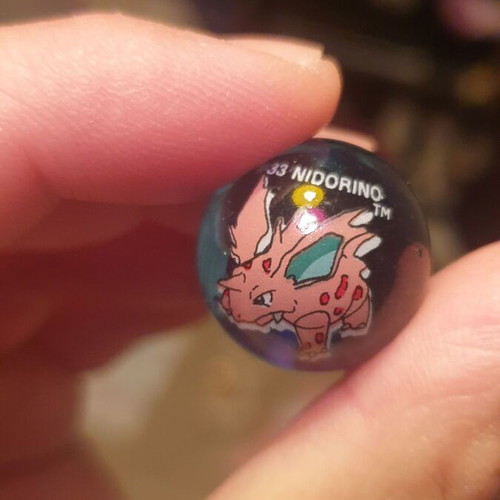 Raichu & Nidorino marbles like new, collectible