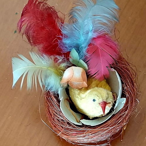 Vintage Easter nest used with yellow chick and colorful feathers