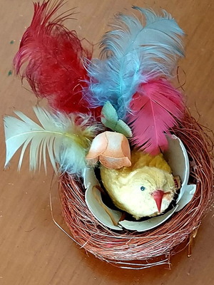 Vintage Easter nest used with yellow chick and colorful feathers