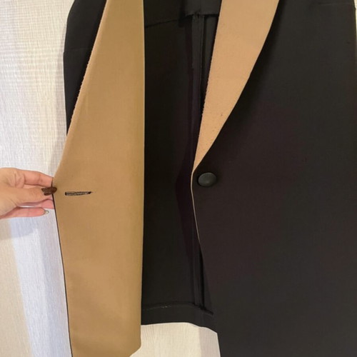Sleeveless jacket used, black and tan, size small