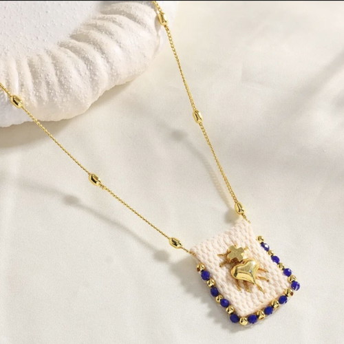 Steel necklace new, gold tone with blue beads and handmade motif