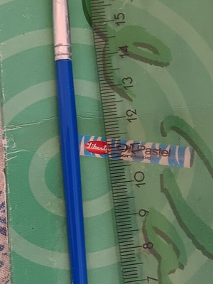 School round paintbrush with blue handle and synthetic bristles