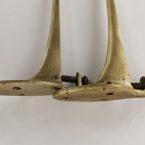 Pair of brass curtain hooks with clamp used