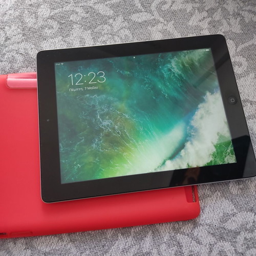 Apple iPad tablet like new, older model with red case