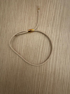 Beige bracelet like new with gold metal details