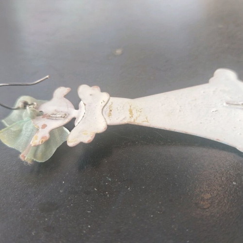 Single long earring used, about 8 cm