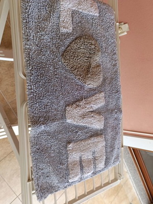 Bathroom mat like new, light blue with white letters and gray heart