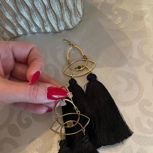 Dangling earrings with black tassels and gold details like new