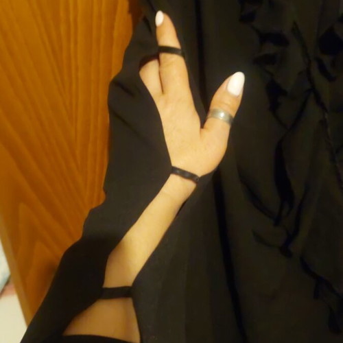 Dress with ruffles and sleeve openings like new, black
