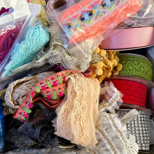 Decorative ribbons, cords, lace and craft elements like new