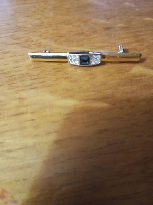 Jewelry pin like new, gold color with blue and clear stones
