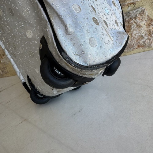Smiley metallic travel bag used with embossed smiley and star designs