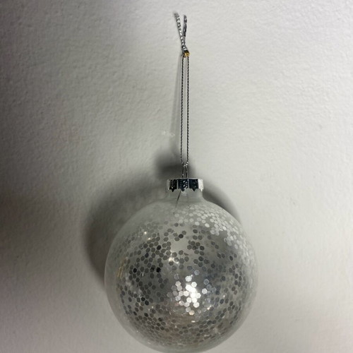 Christmas ball with silver glitter like new, transparent