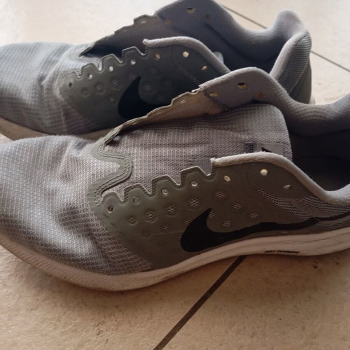 Nike men's athletic shoes, grey, size 43, missing laces