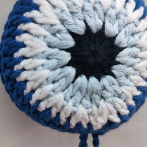 Handmade knitted eye in dark blue color